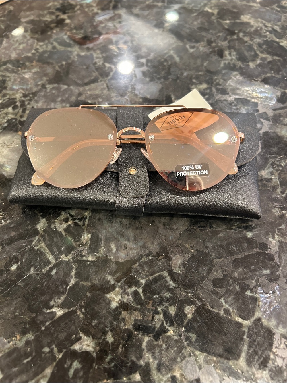Fossil Rose Gold Round Sunglasses with Pink Lenses